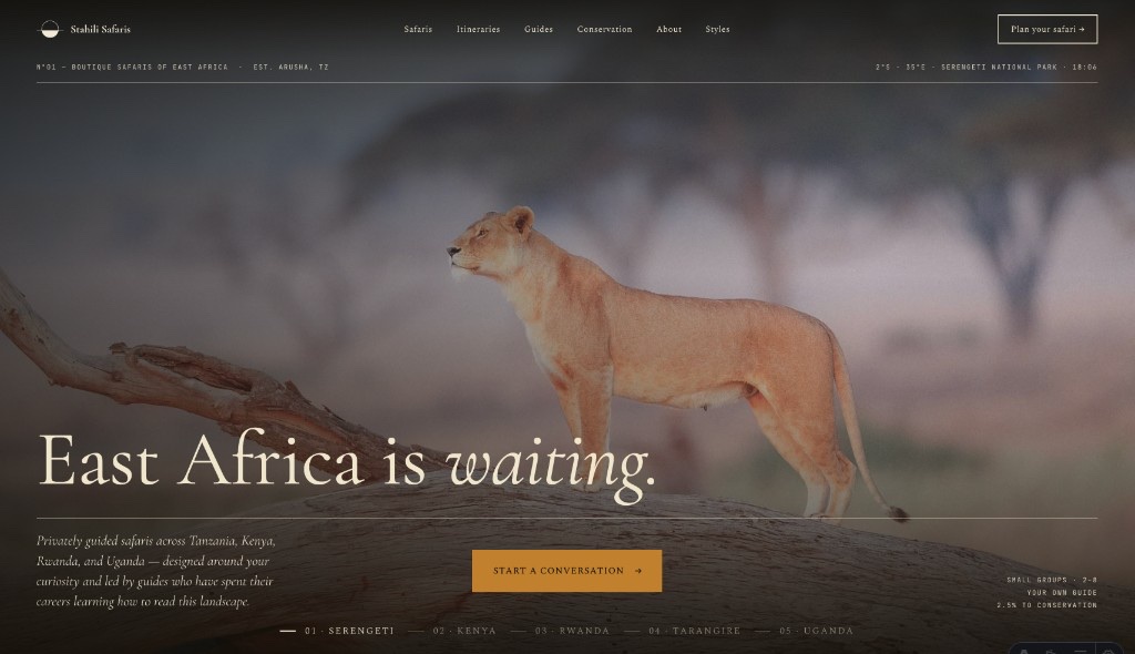 Stahili Safaris website homepage hero featuring a lioness on a fallen tree trunk in the Serengeti, with the headline “East Africa is waiting.” and a Start a Conversation call to action.